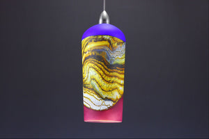 Cylindrical-Strata-Pendant-in-Cobalt-&-Red-Amethyst-on-Danielle-Blade-and-Stephen-Gartner-Eclipse-Gallery